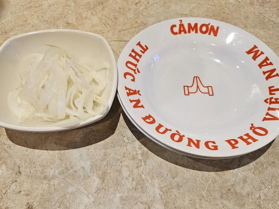 Table set with pho and side dishes together