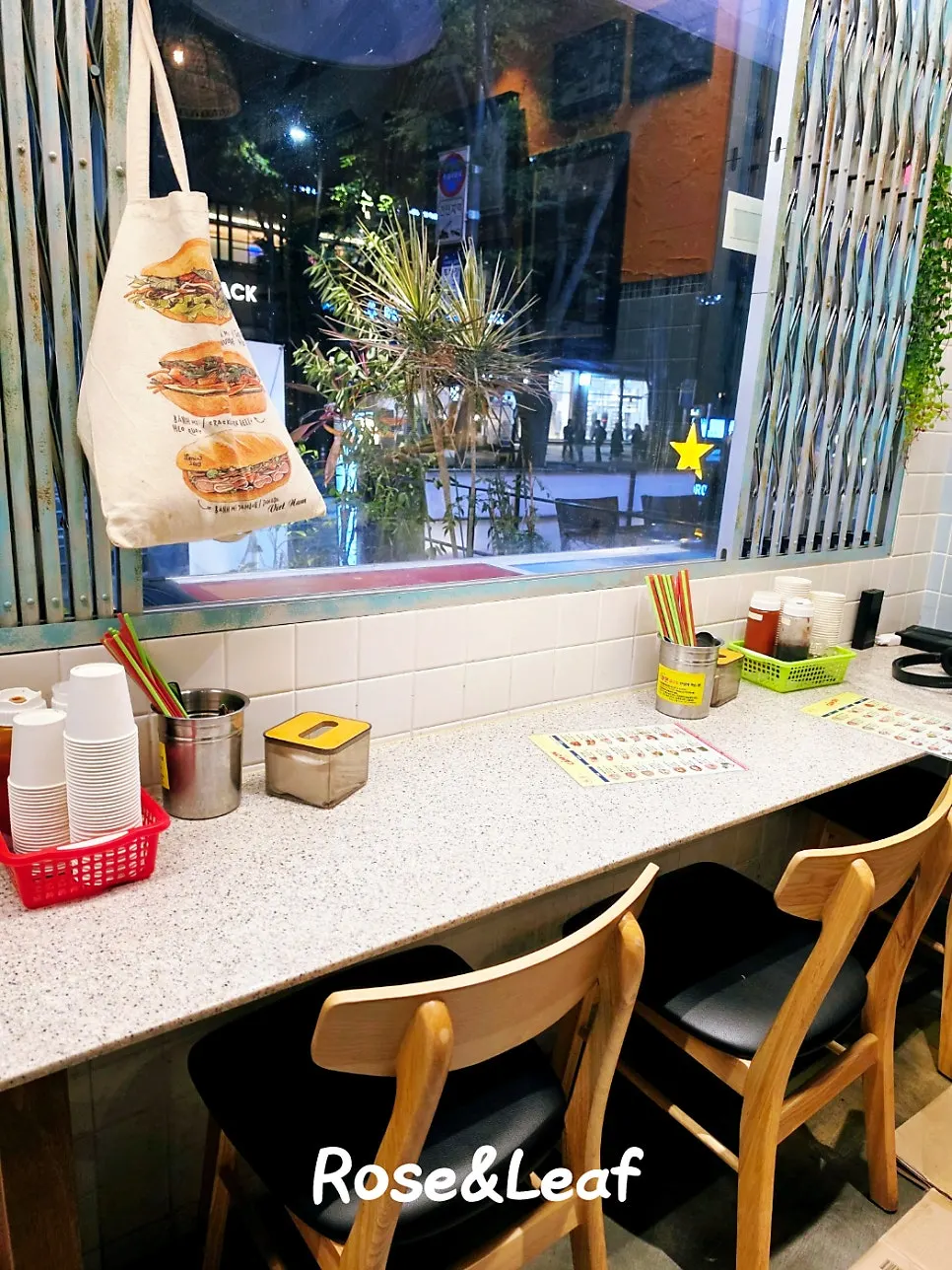 Interior with rattan lighting and wood furniture