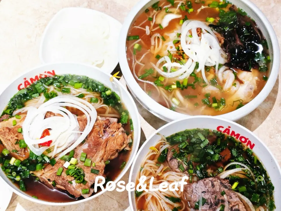 Three bowls of pho placed on the table