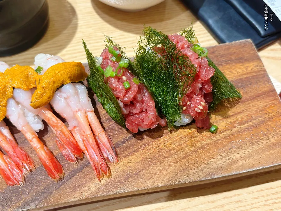 Plate of vividly colored beef tartare gimtae sushi