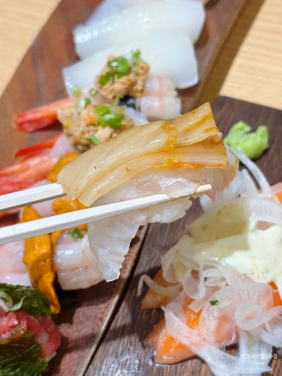 Flounder sushi topped with aged kimchi