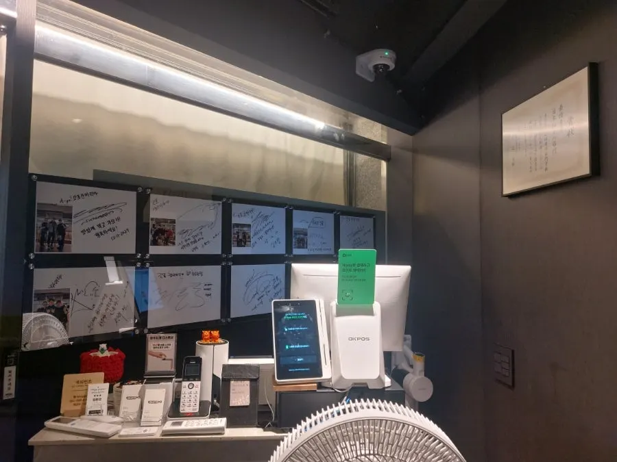 Autograph board on the restaurant wall