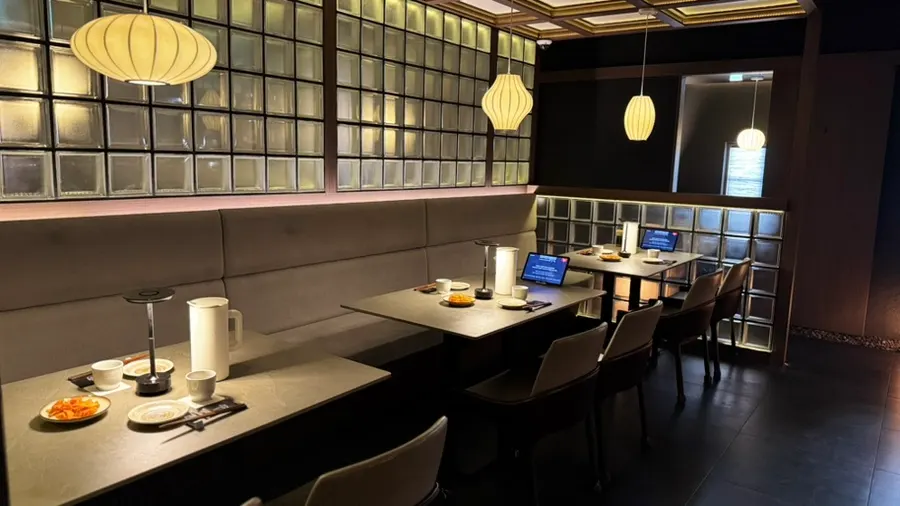 Japanese dining interior in deep wood and black tones