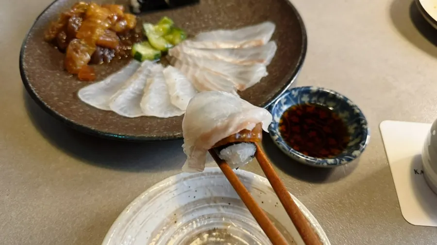 Thinly sliced raw flounder, mukeunji, and gimbap