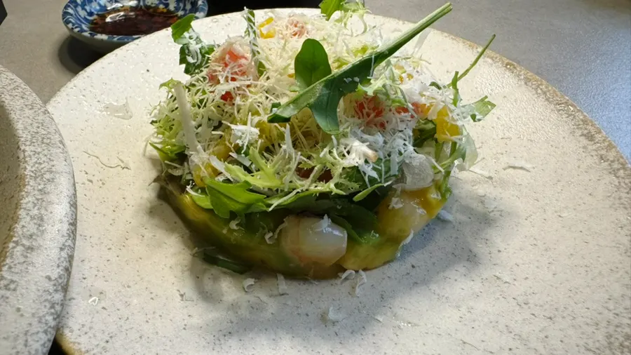 Ceviche and pasta served together on the table