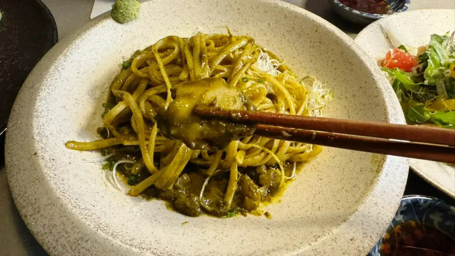 A bite of the innard pasta with a chunky piece of abalone