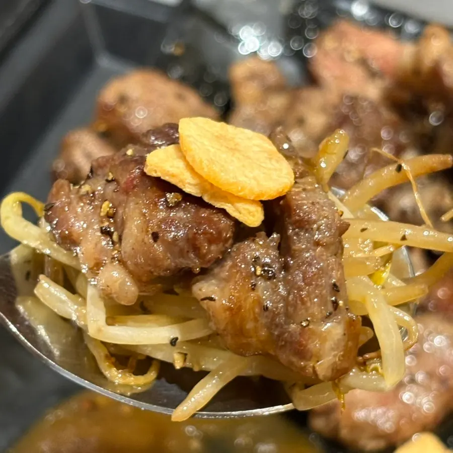 Close-up of thinly sliced short rib steak