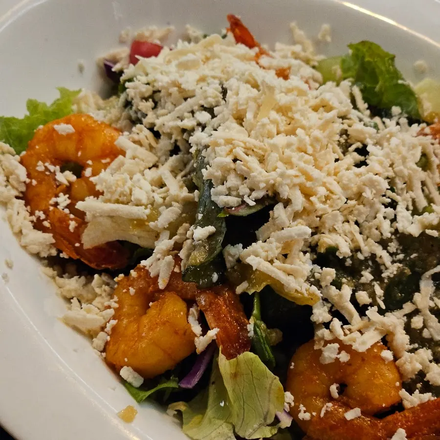 A full plate of shrimp paneer salad