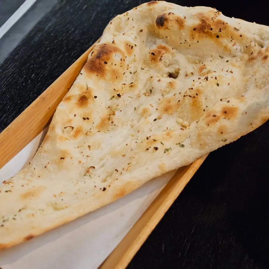 Warm garlic naan served fresh