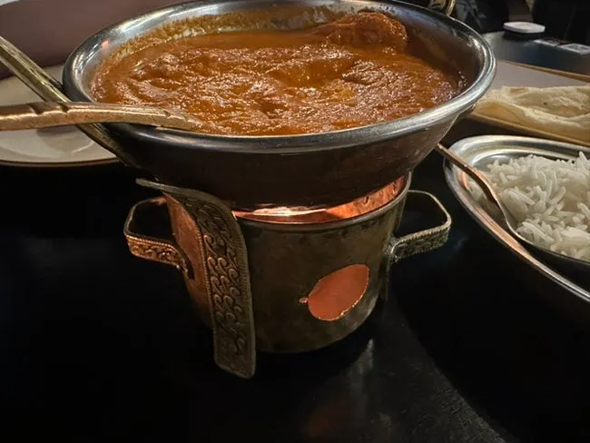 Warm curry sitting on a warmer