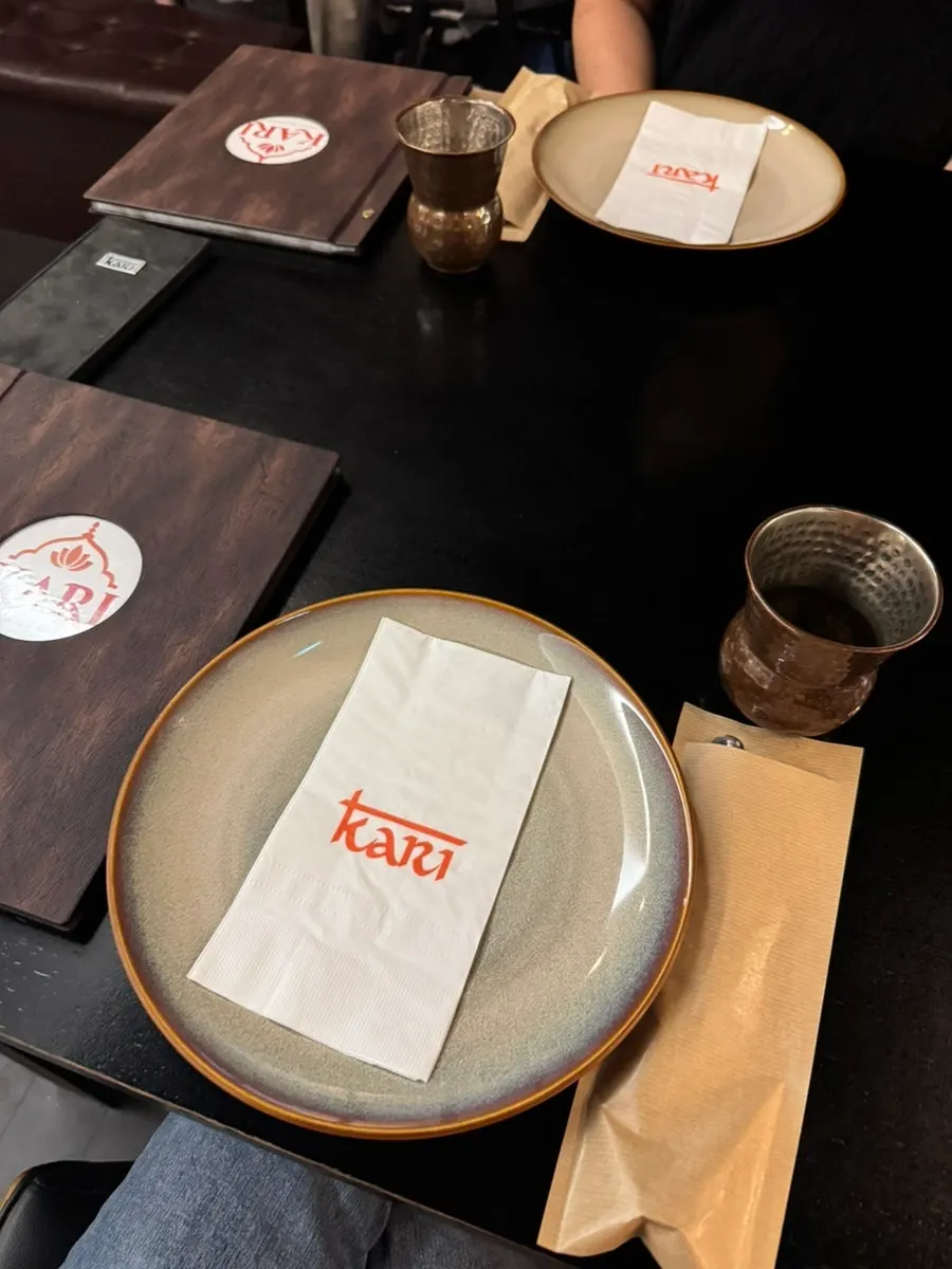 Table setting with cutlery, plates, and pu-erh tea