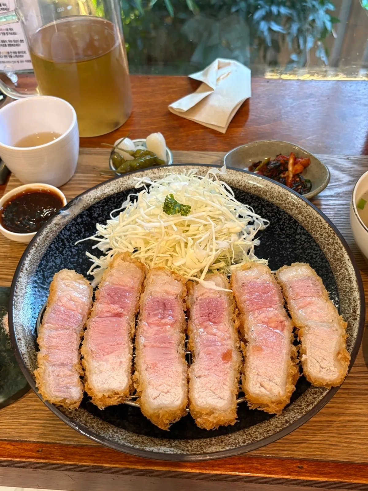 Dressing sauce and spicy sauce served with the tonkatsu
