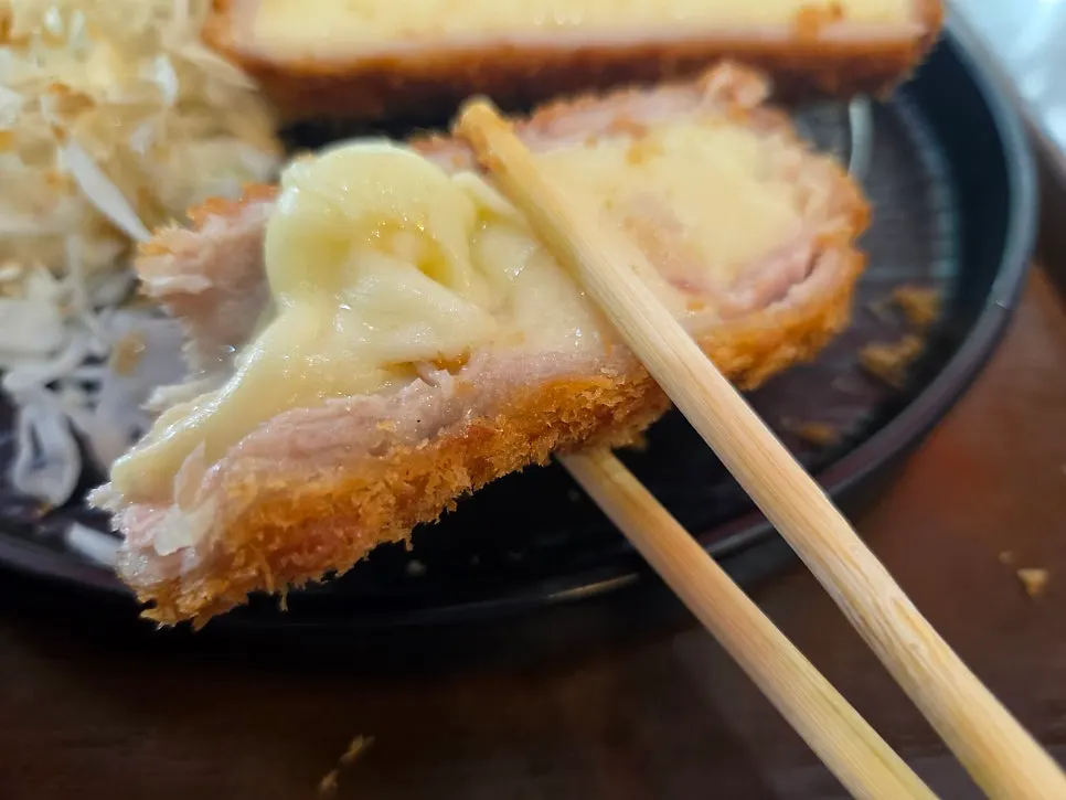 Cheese stretching long from the cheese katsu