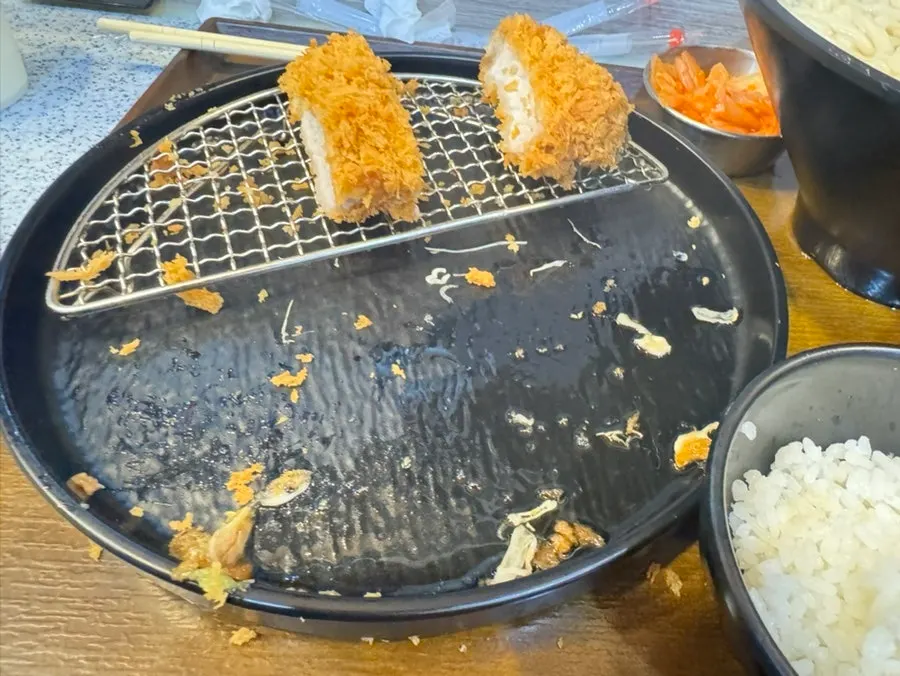 A piece of tonkatsu topped with wasabi
