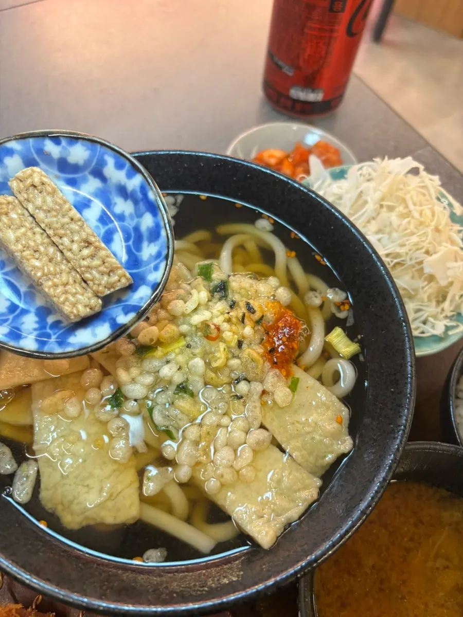 A single piece of sangloin katsu lifted up