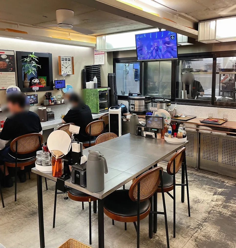 Interior of Katsu Monster Yeonnam Main Branch with high ceilings