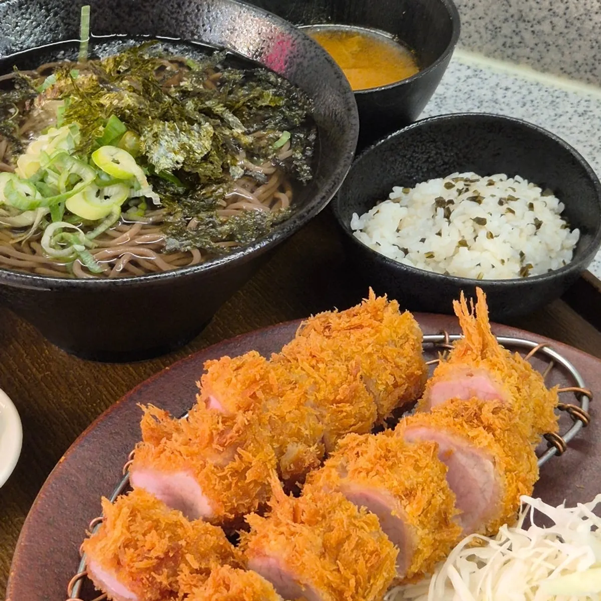 Solo set with fillet pork cutlet and soba laid out on the table