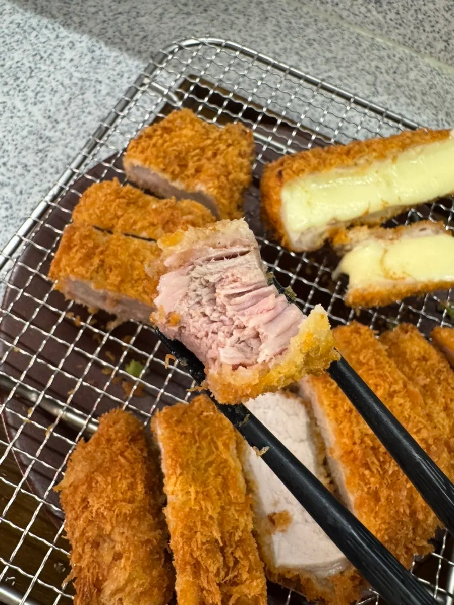 Plate of triple katsu eaten alternating loin and fillet