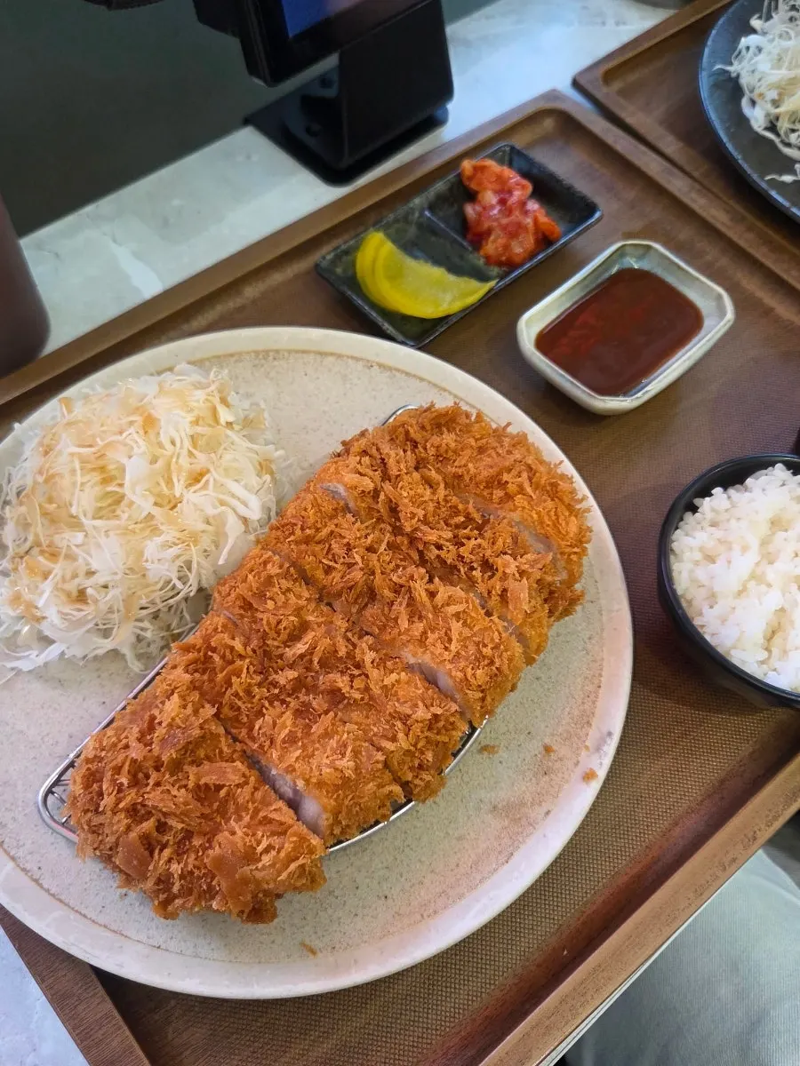 A thick serving of rosu katsu pork loin cutlet