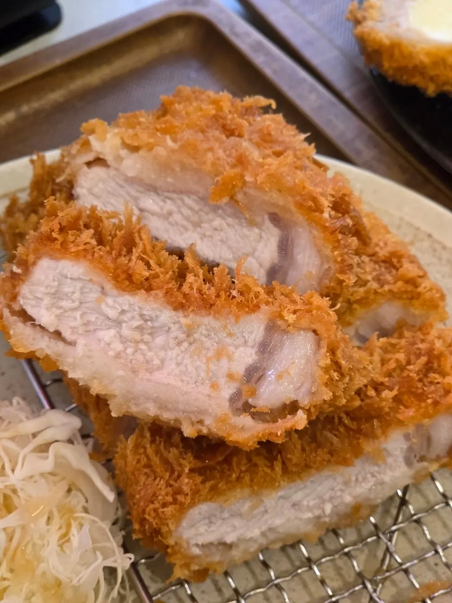 Cross-section of the rosu katsu showing crispy breading