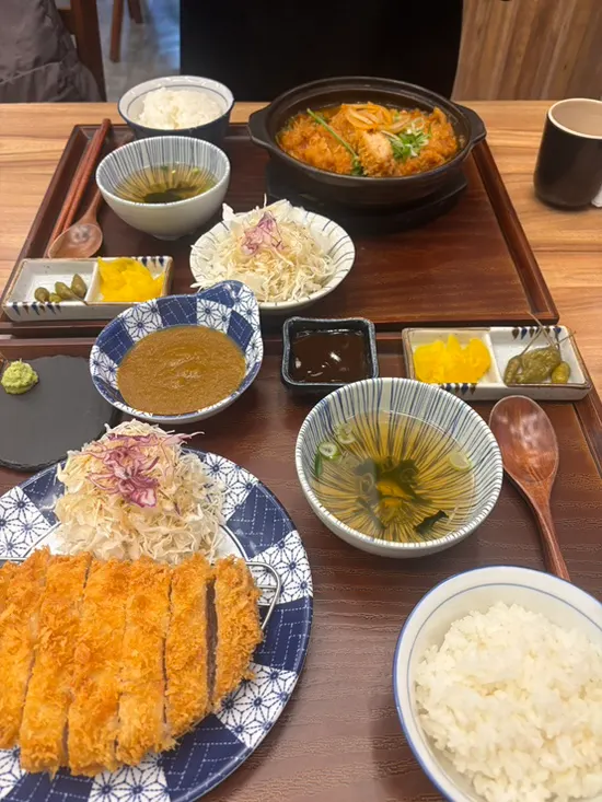 Full spread of loin katsu and kimchi katsu nabe served together