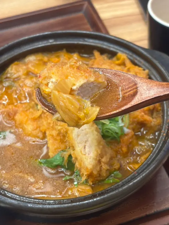 A piece of katsu from the kimchi katsu nabe, soaked in broth