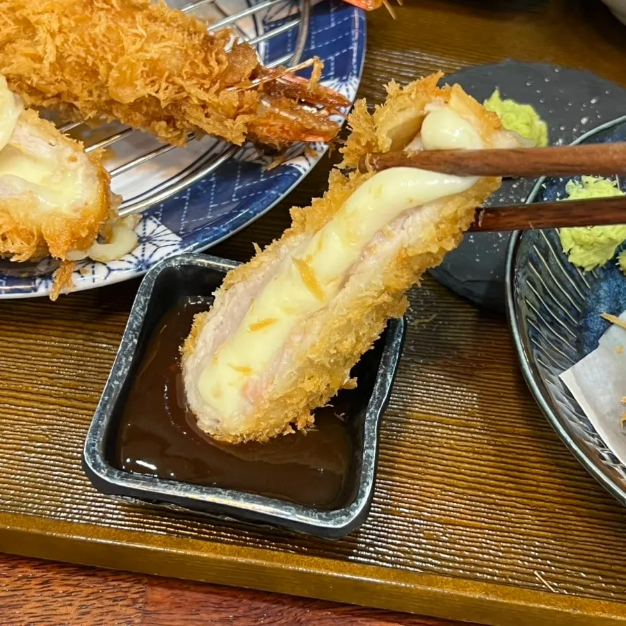 Cheese katsu stretching with melted cheese