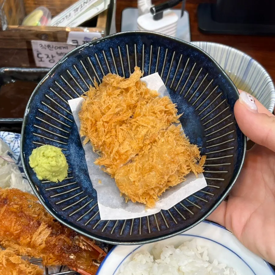 Cheese katsu dipped in brown tonkatsu sauce