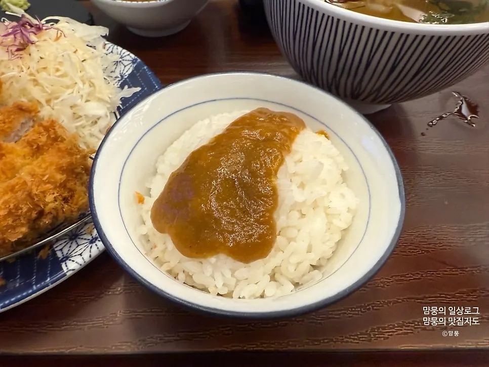 Curry spooned over rice