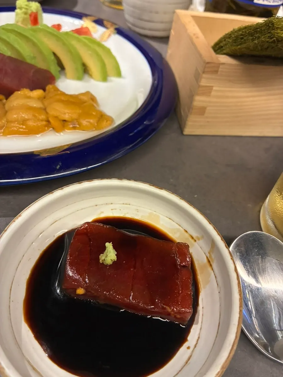 Table with sashimi and nabe served together