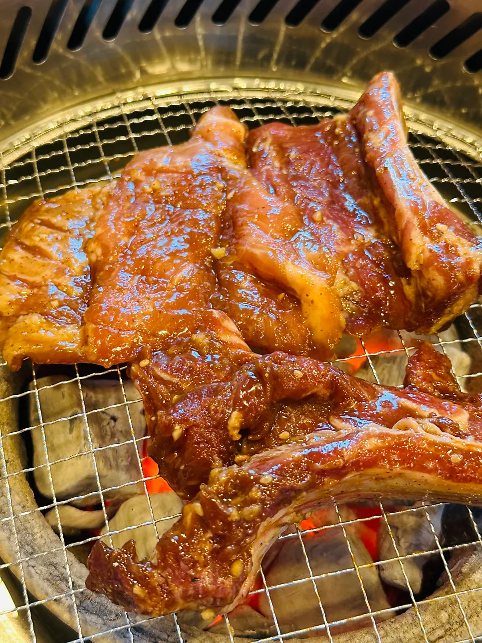 Marinated pork galbi placed on the charcoal grill