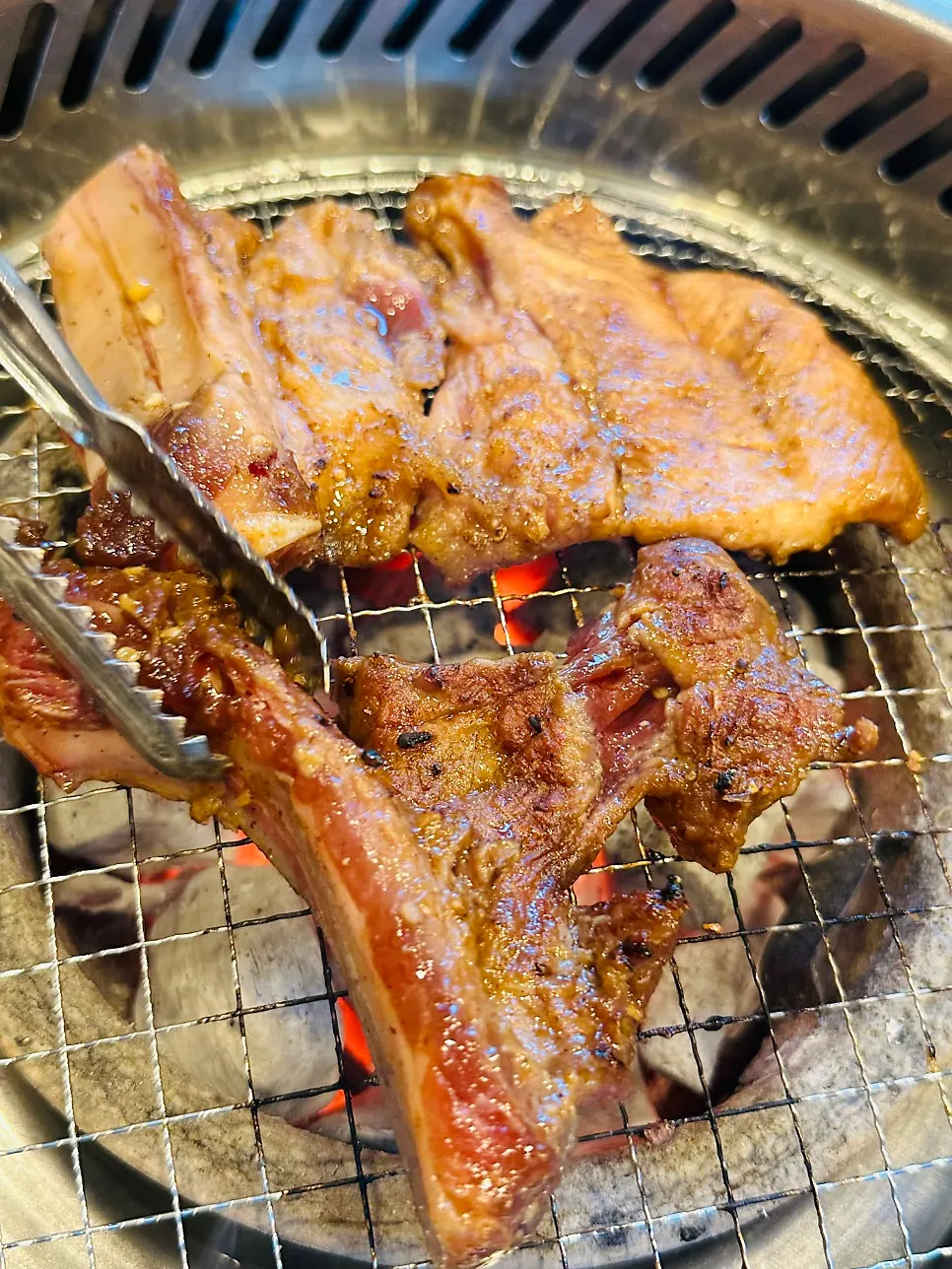 Pork galbi cooking and absorbing the charcoal aroma