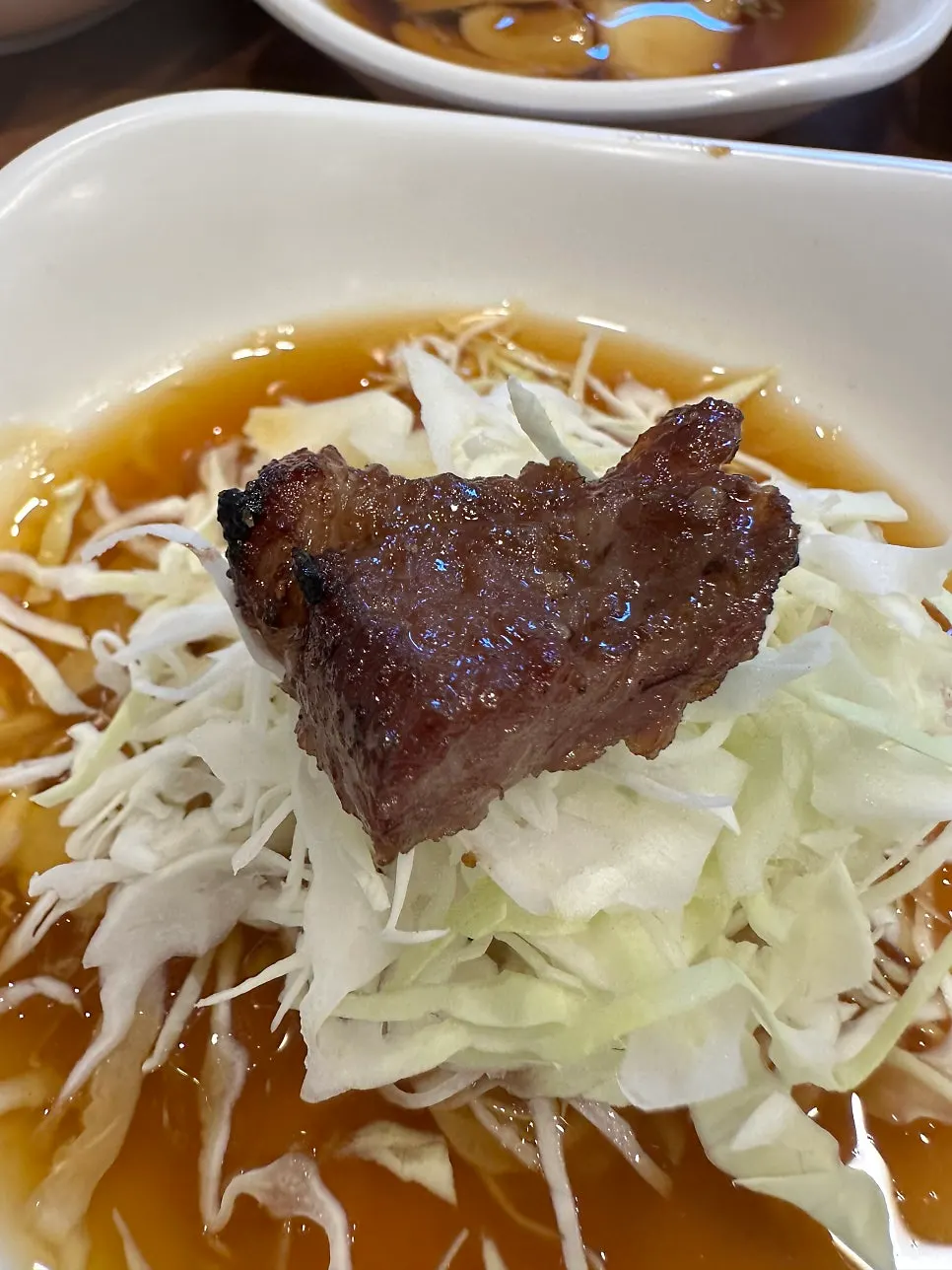 A piece of pork galbi picked up to eat