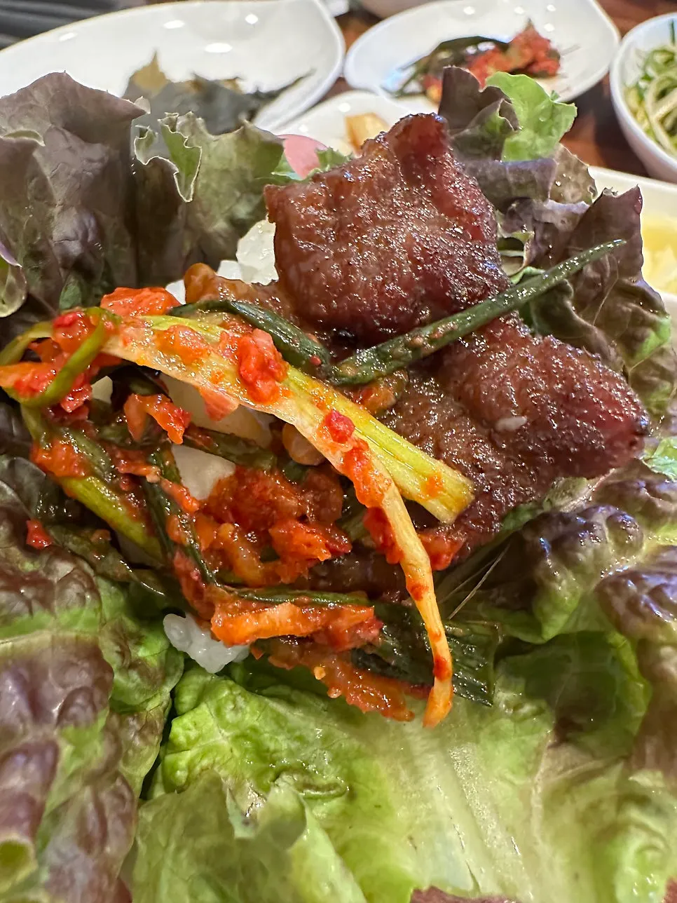 Pork galbi and scallion kimchi wrapped in lettuce