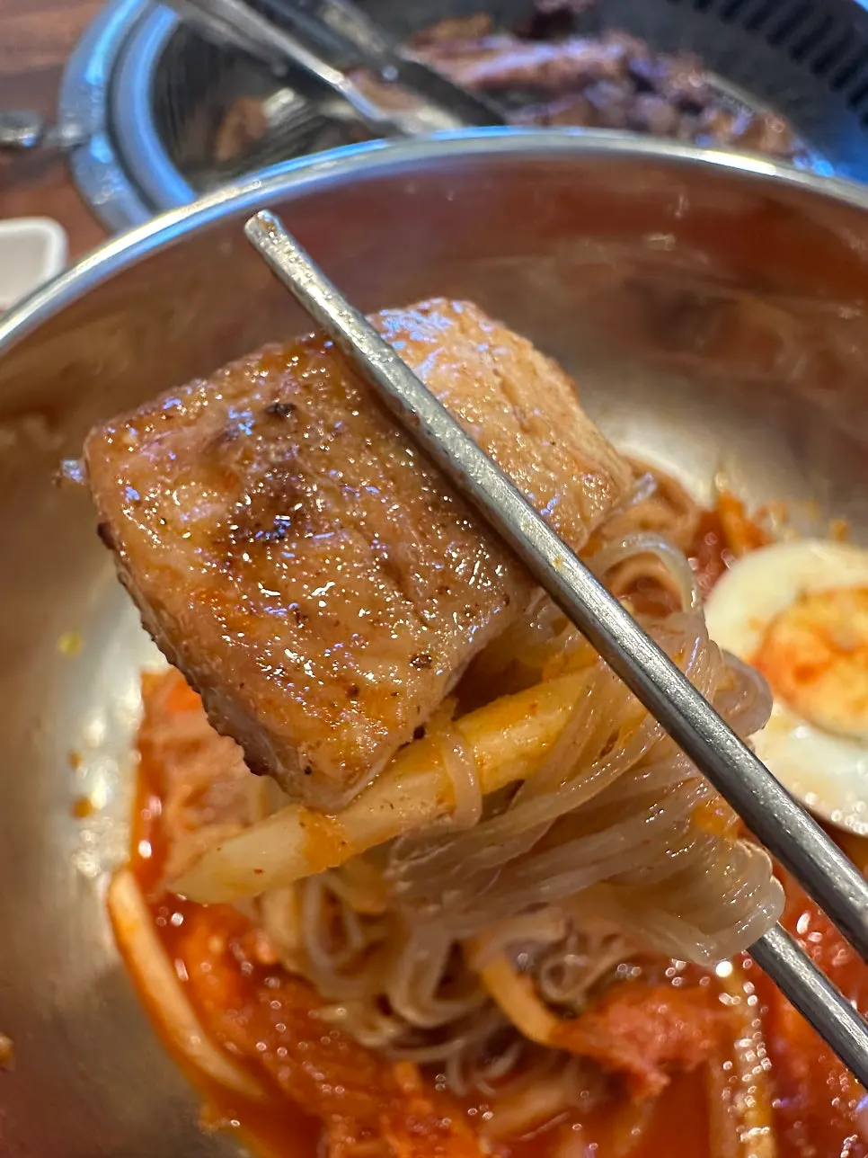 Mixed pollock naengmyeon with a wrap of pork galbi