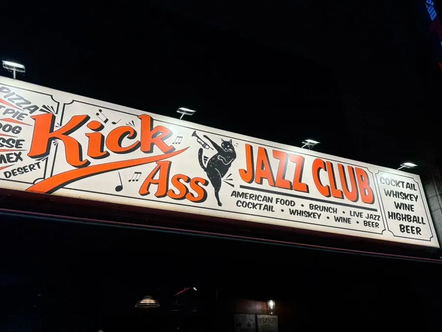 Kick Ass Jazz Club sign featuring a black cat