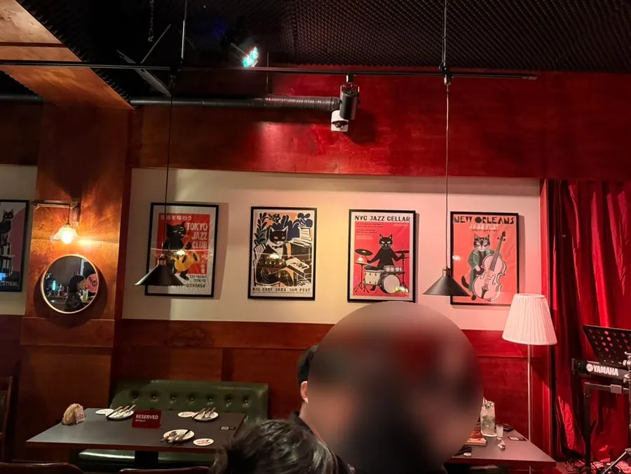 View of the Kick Ass Jazz Club stage from a bar table