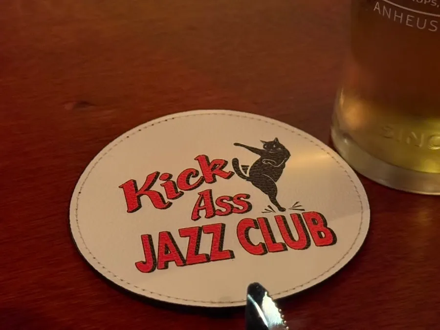 Kick Ass Jazz Club coaster with a cat illustration