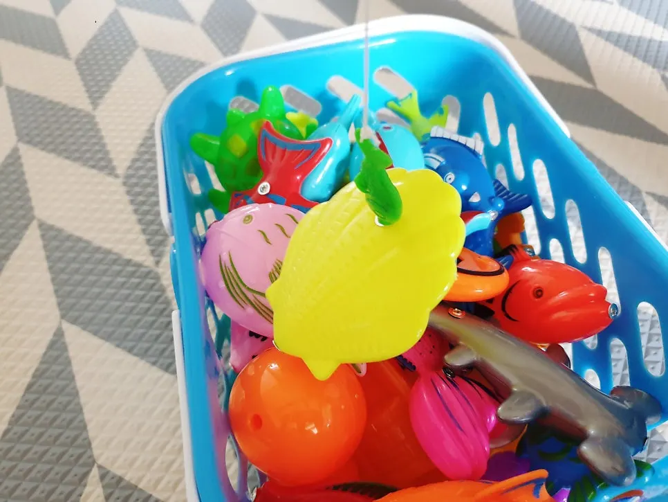 Playing with a magnetic fishing rod toddler toy