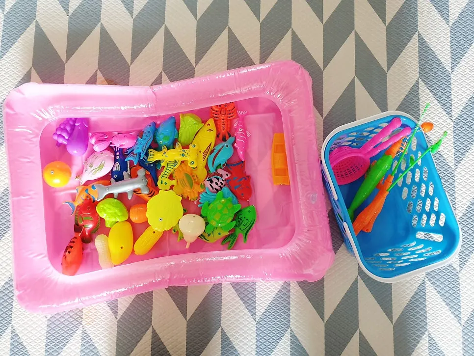 Complete fishing game set and a child playing