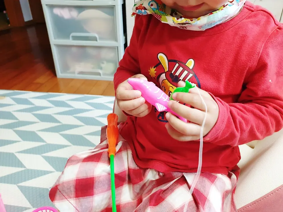 Child putting fish away in the basket