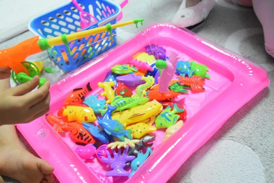 Children enjoying a magnetic fishing game