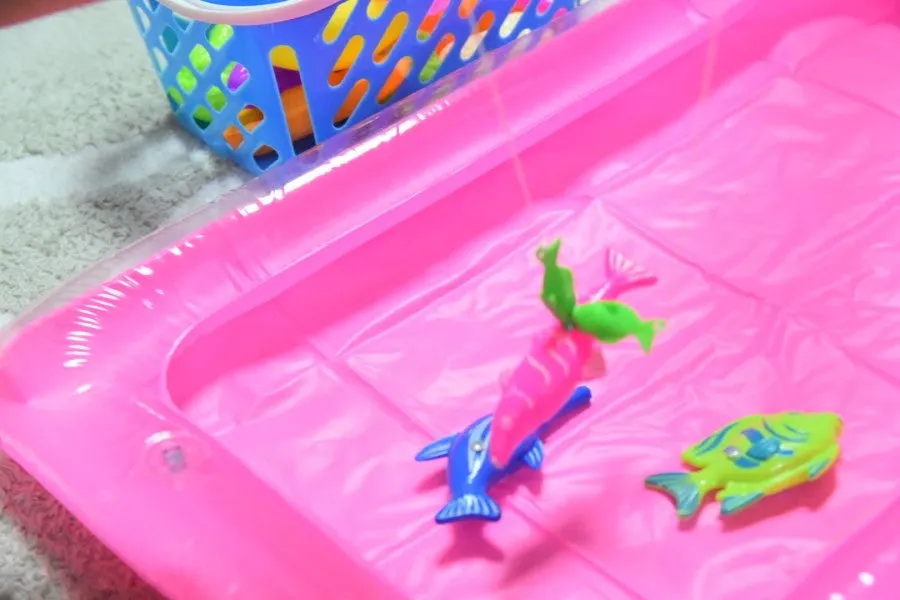 Fishing game played alongside a play kitchen set