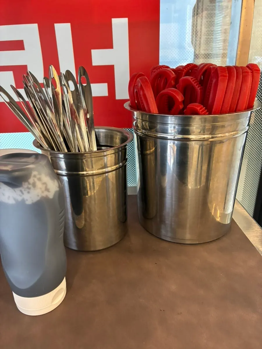 Dishes and utensils at the self-serve corner