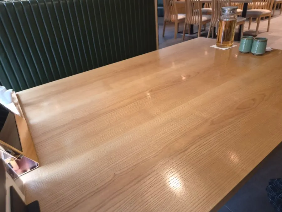 Wide wood-tone table set for two