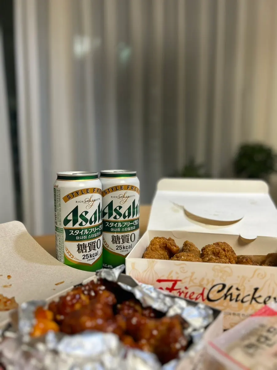Takeout chicken set out with beer