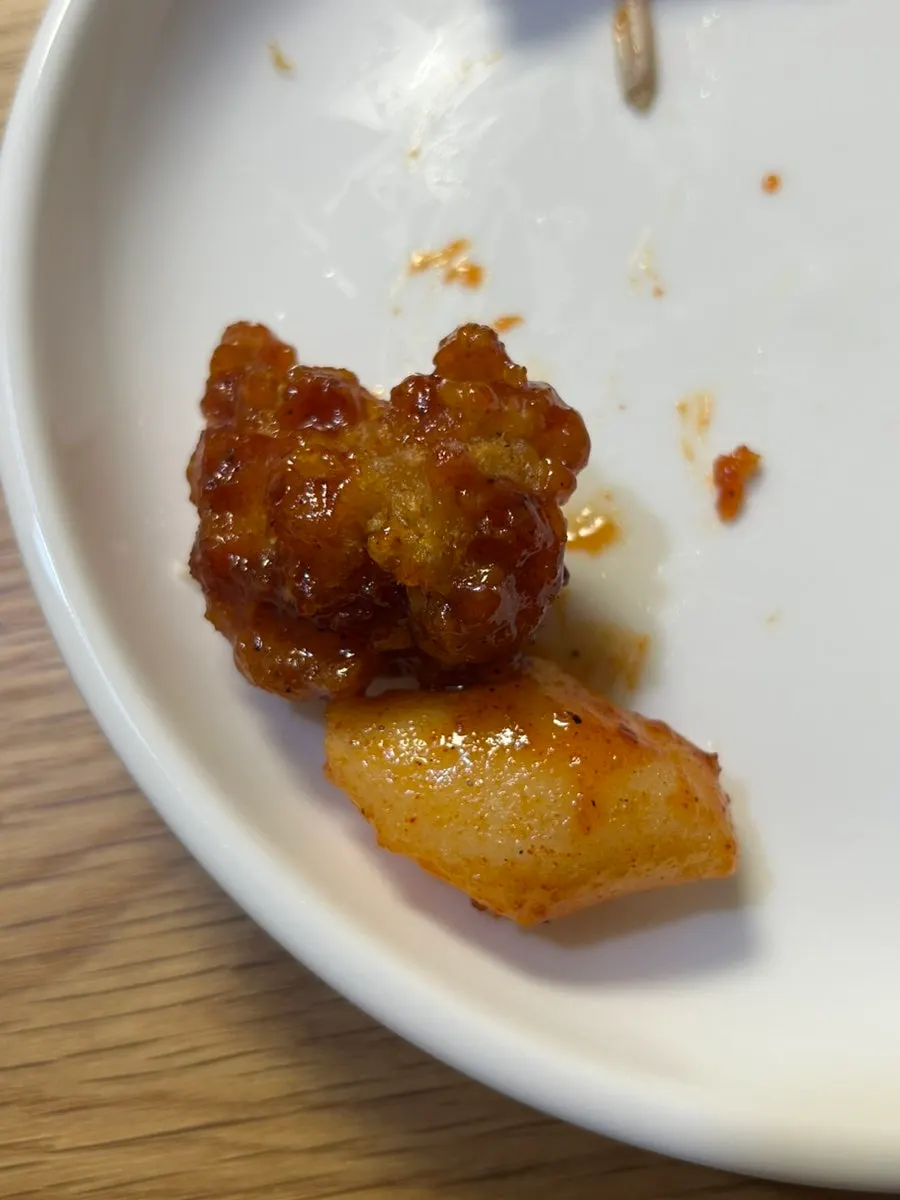 Crispy batter on a fried chicken drumstick