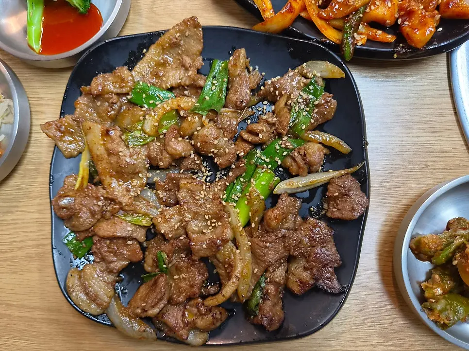 Two glistening servings of soy-sauce grilled meat