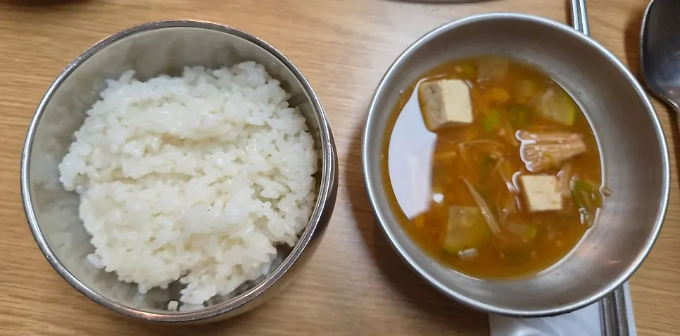 A table setting with rice and doenjang stew