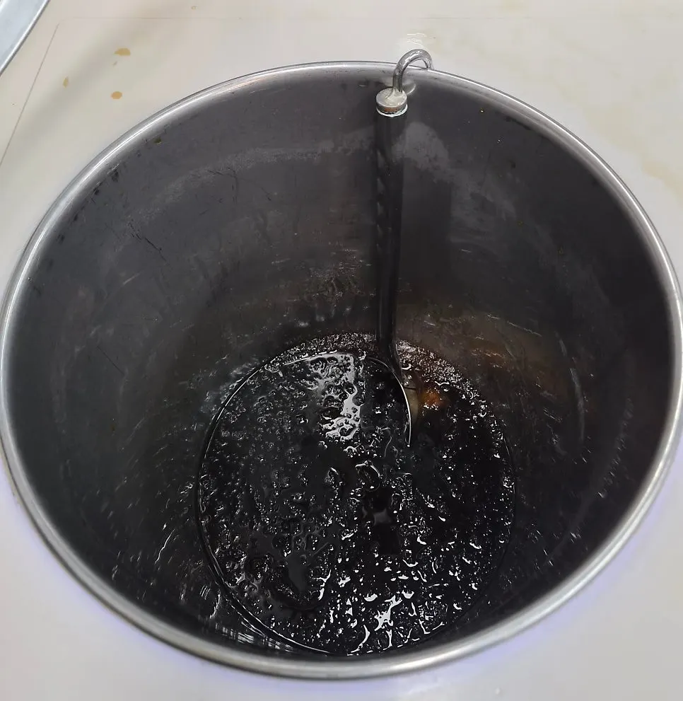 Cool plum tea with icy bits floating in it